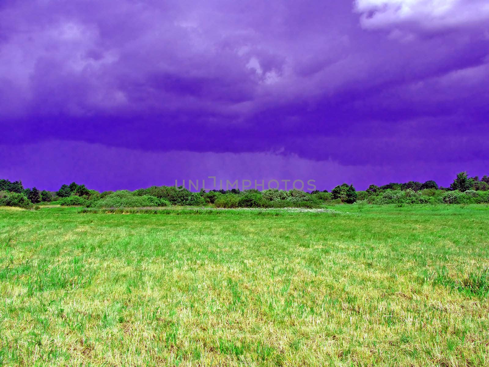 cocked field before thunderstorm