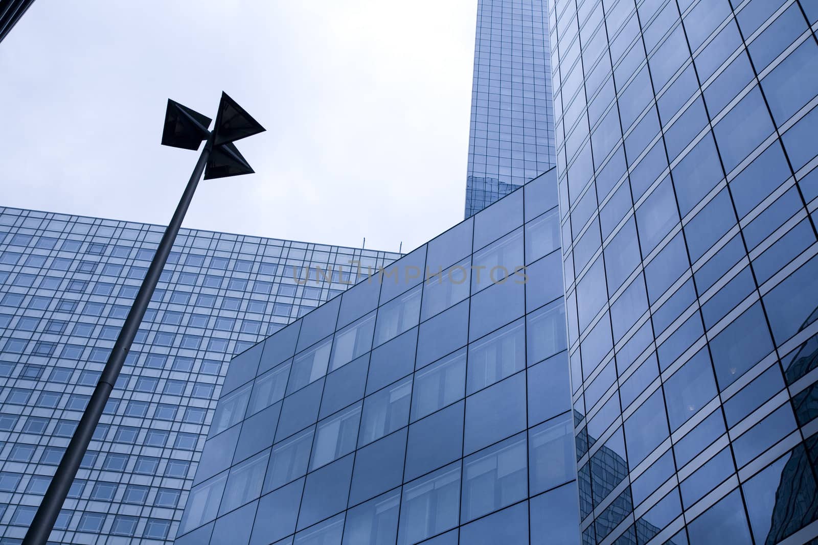 Futuristic corporate office buildings - La Defense, Paris. Space for text.