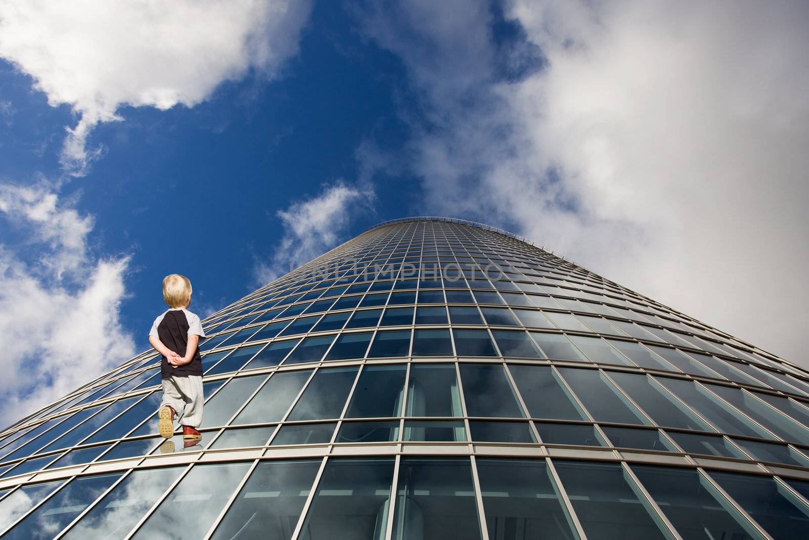 Child and his path to future. Perspective of skyscraper windows