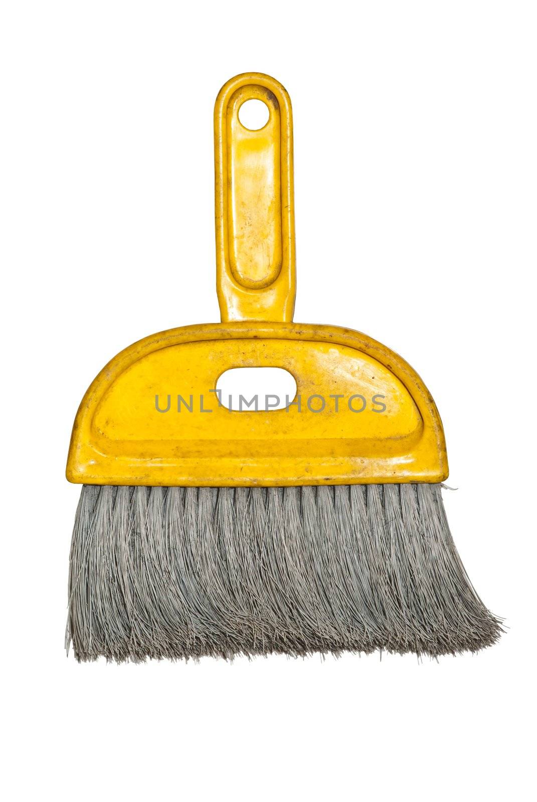 Old yellow brush in white isolated background
