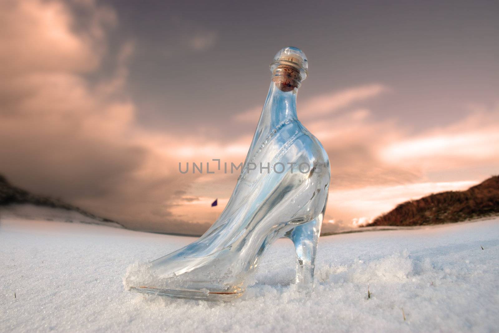 a glass slipper in a snow covered irish golf course for a concept on ladies golf