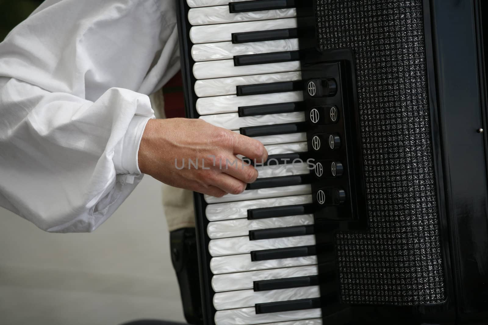 Accordion playing music for a group of folk dancers, Denmark.