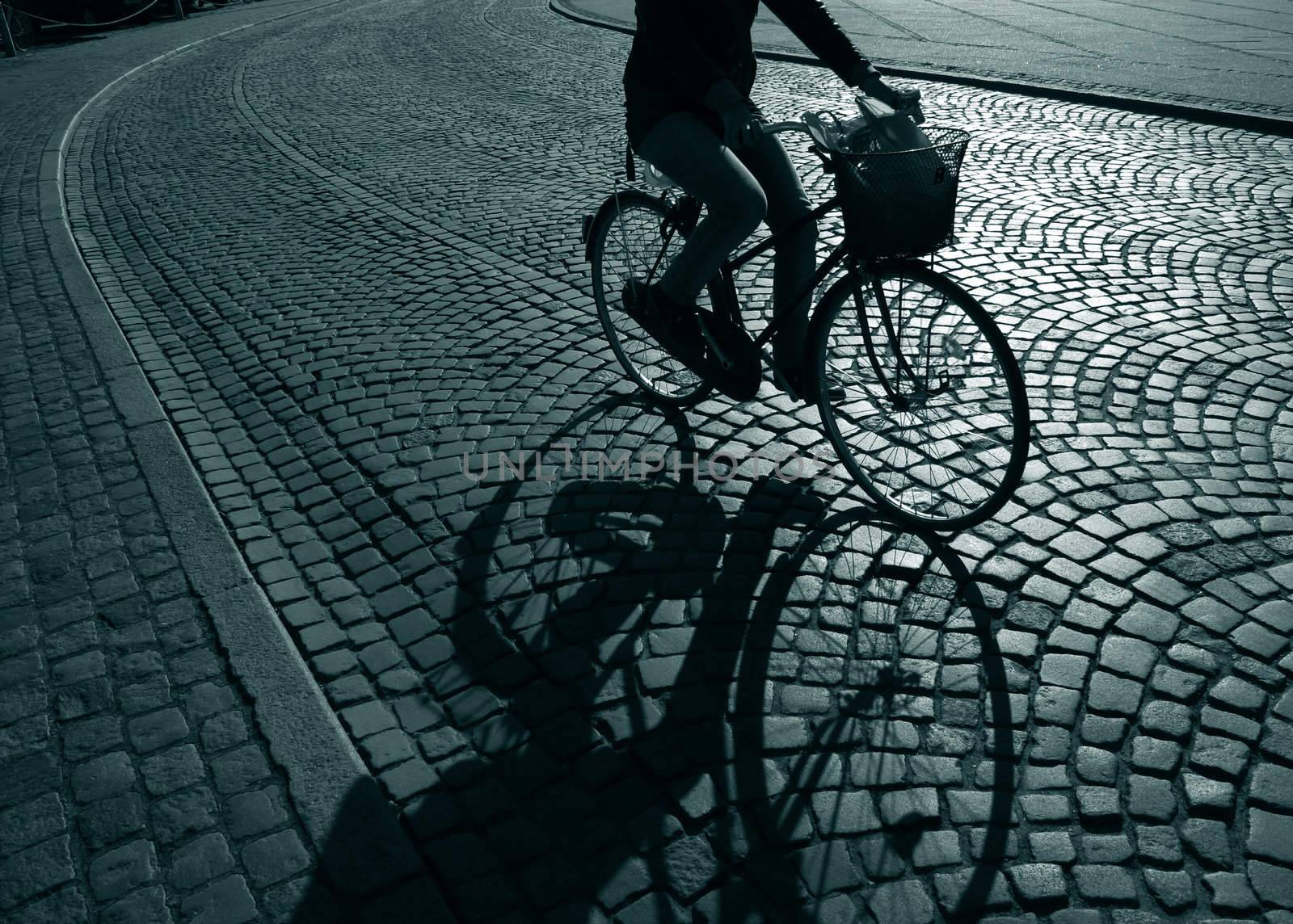 Lonely feamale cyclist on her way home from work - Denmark.