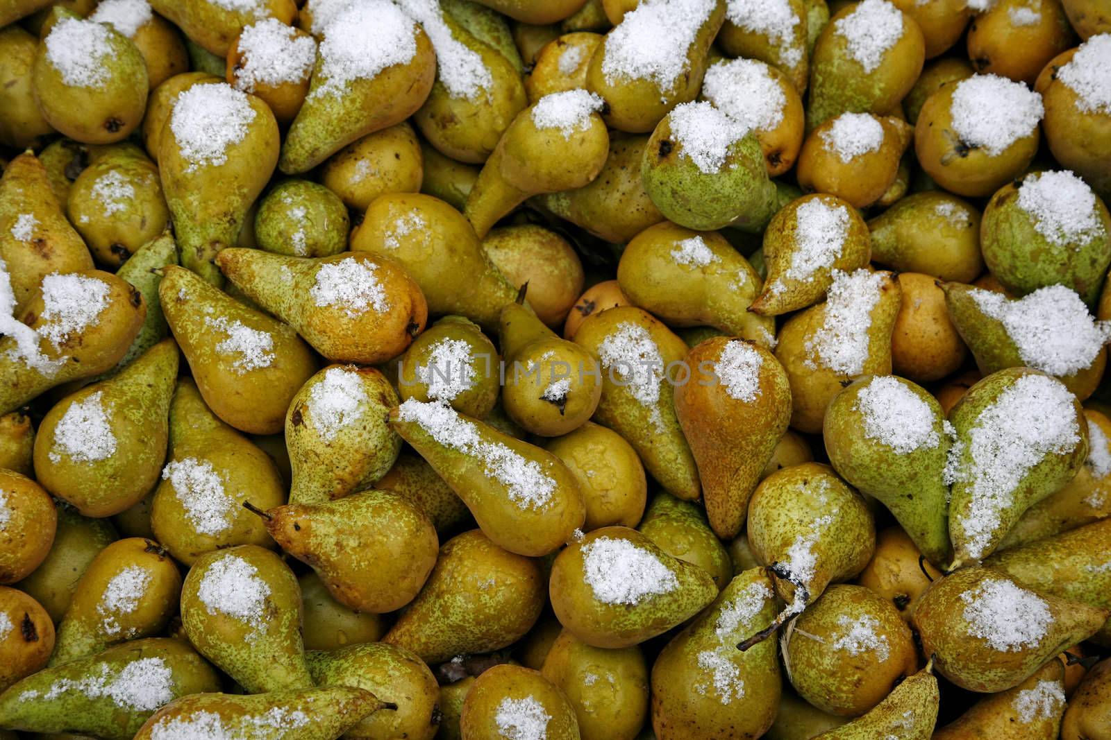 A box of pears seen at a marketplace a cold winterday.