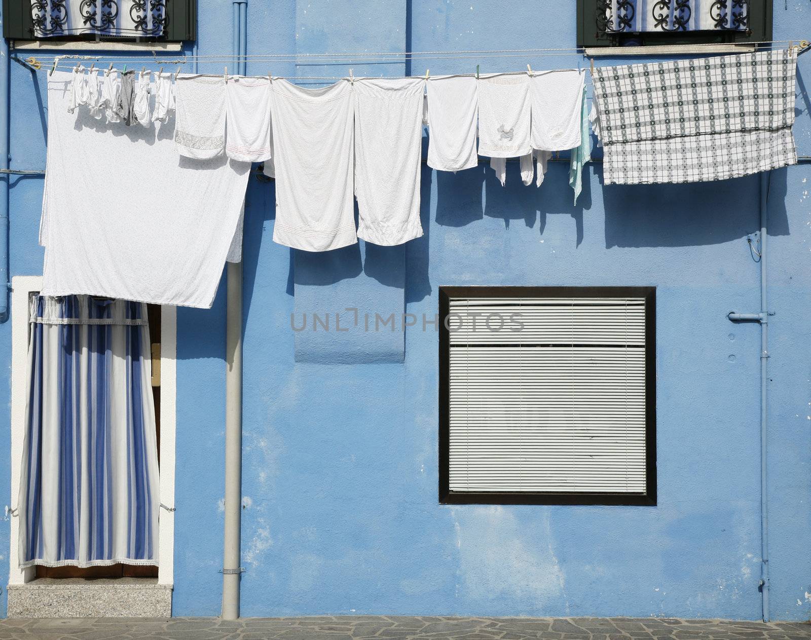 Colorful house on the island of Burano in the Venetian lagoon - Italy.