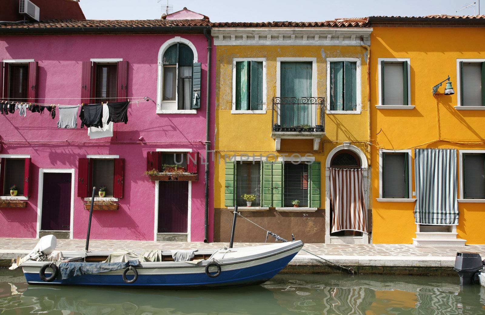 Colorful houses on the island of Burano in the Venetian lagoon - Italy.