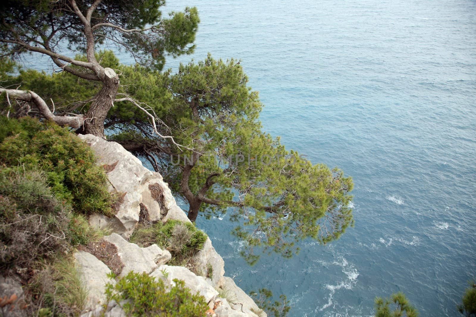 Pictorial blue Adriatic sea with rocks