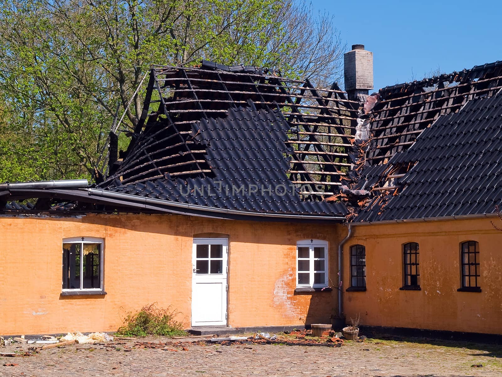 Details of ruins and remains of a burned down destroyed by fire house 