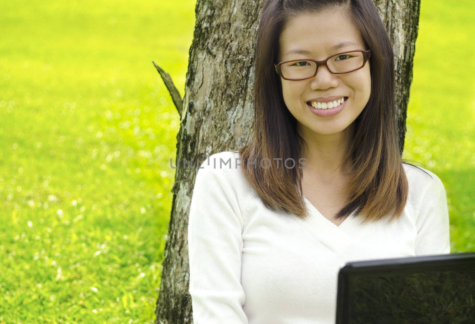 Asian Student Using Laptop Outside School Campus