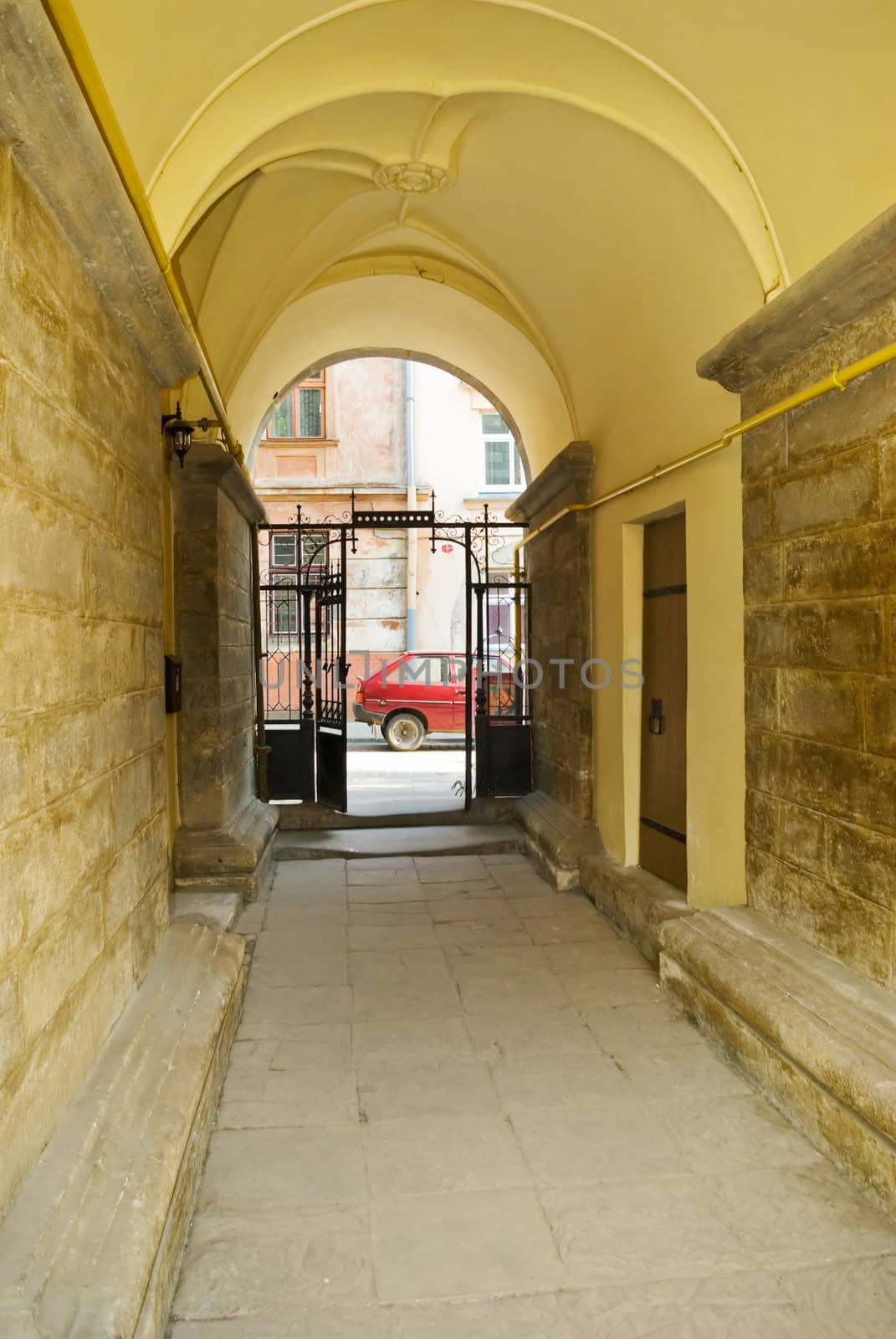 arched passage with a gate in the old town