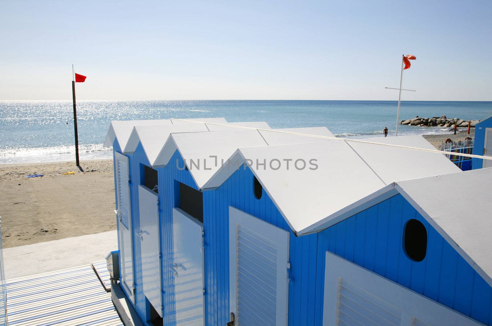 Nice blue beach huts at the Italian Riviera.