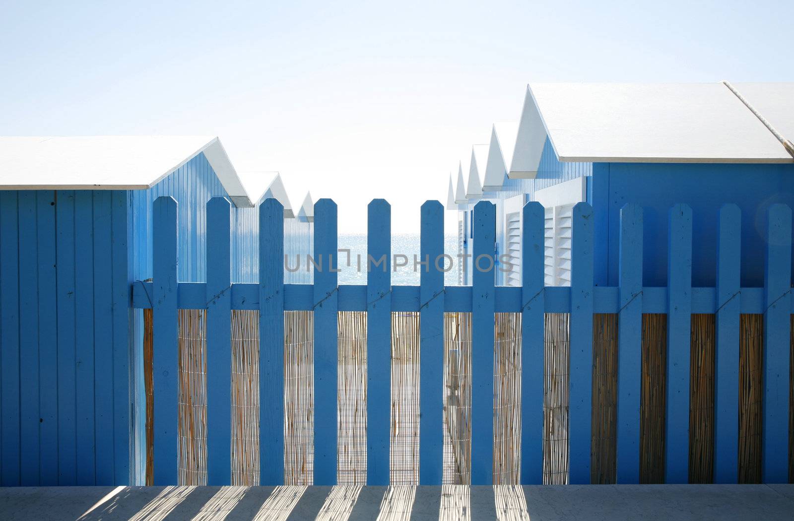 Nice blue beach huts at the Italian Riviera.