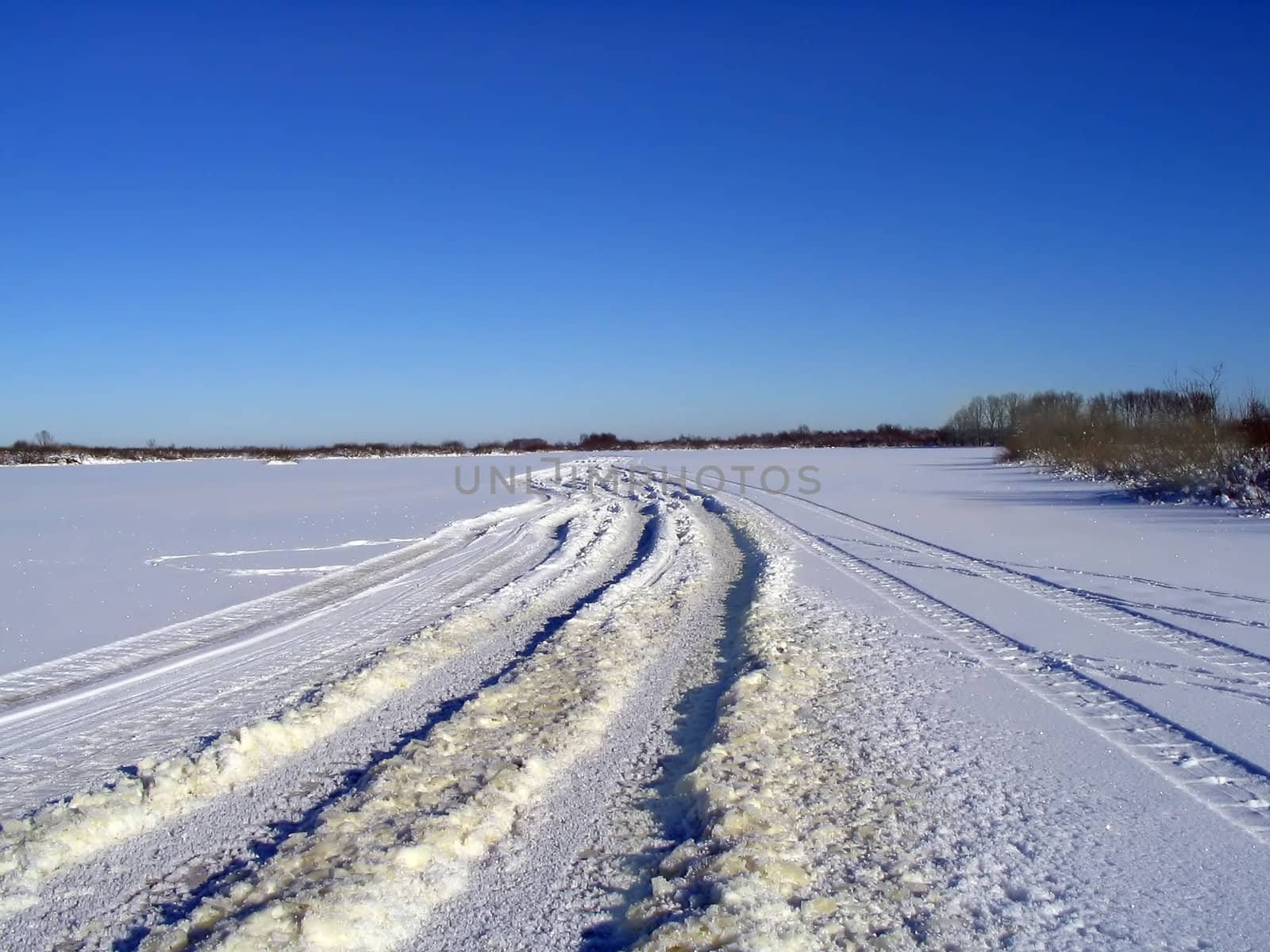 winter road on ice river