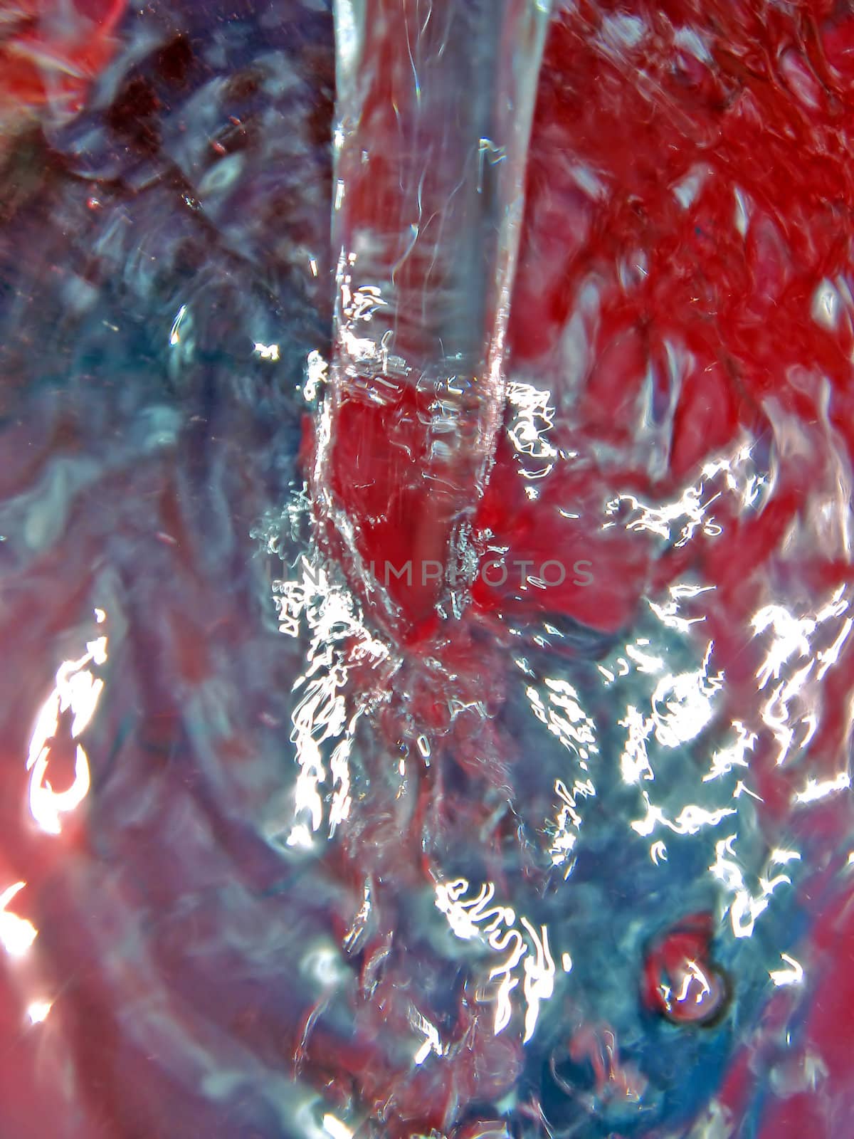 streem of water in red pail