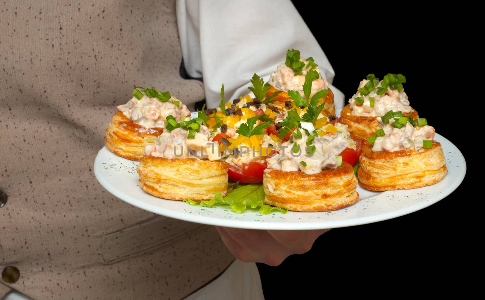 tartlets with salad on dish by starush