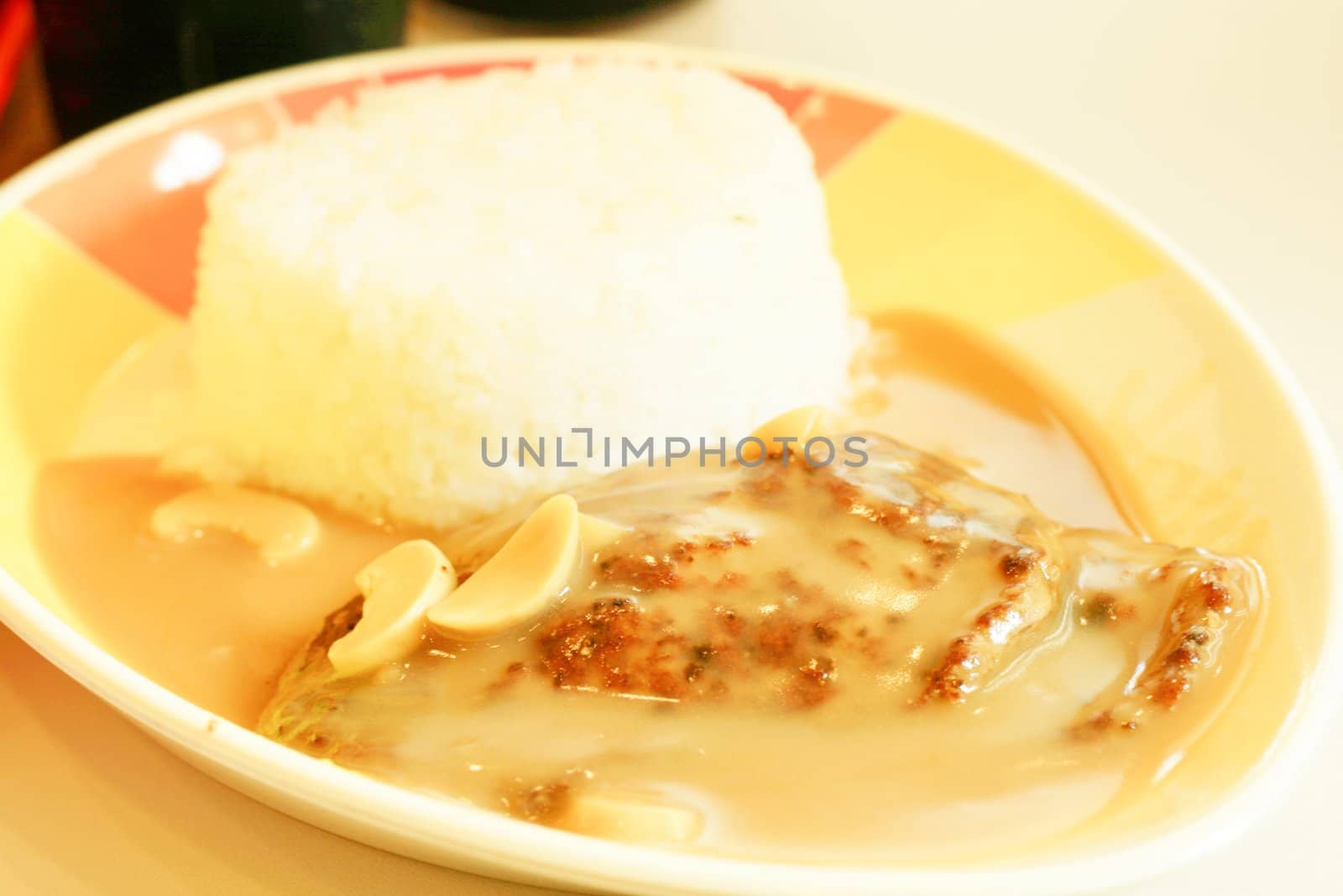 burger stake in mushroom gravy with rice
