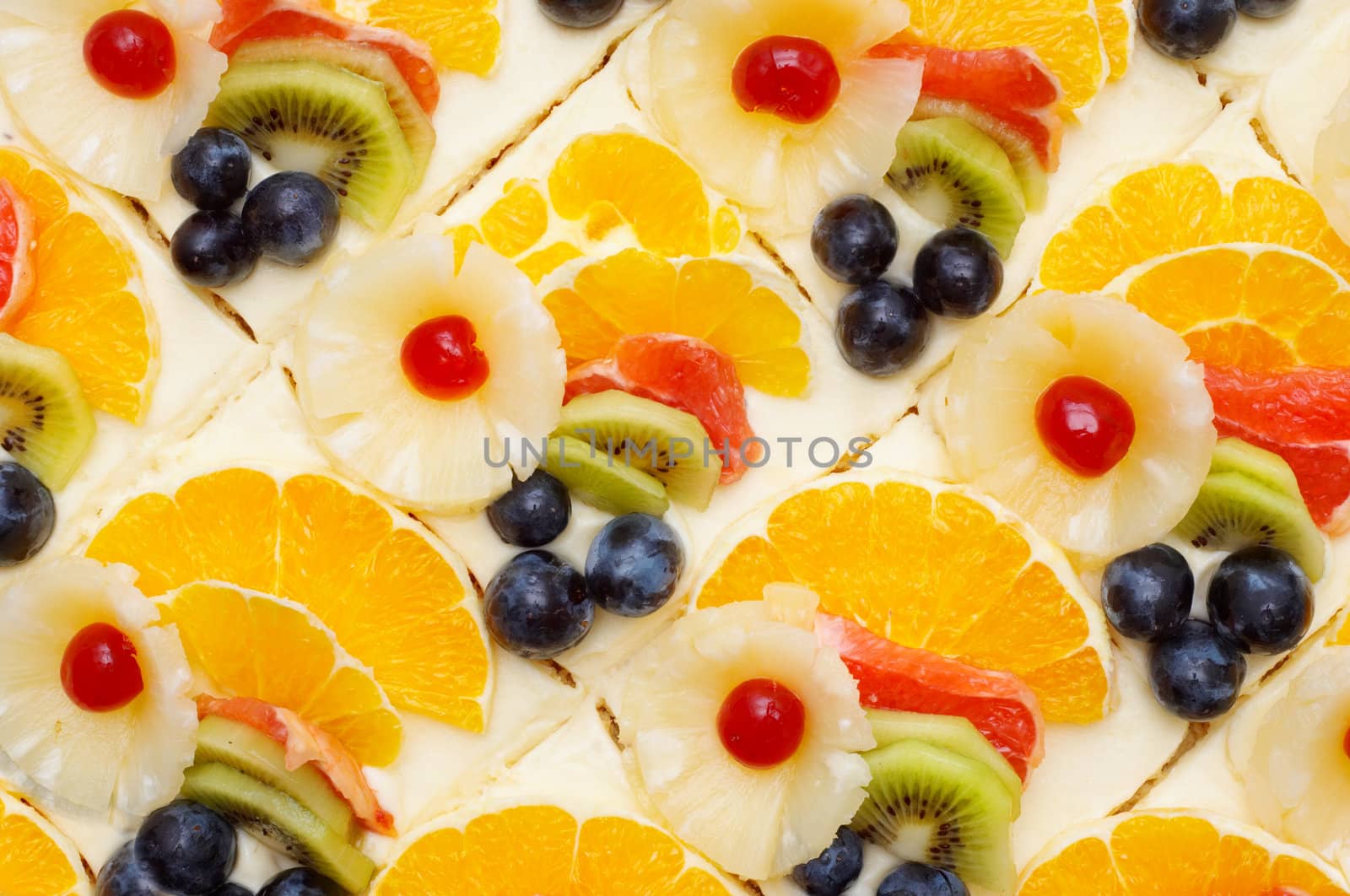 many fruit cakes with custard. suitable as background.