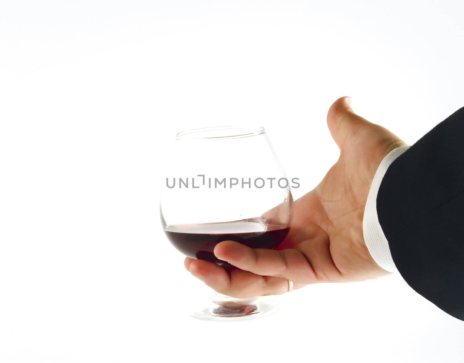 Hand with glass of wine by Vladimir