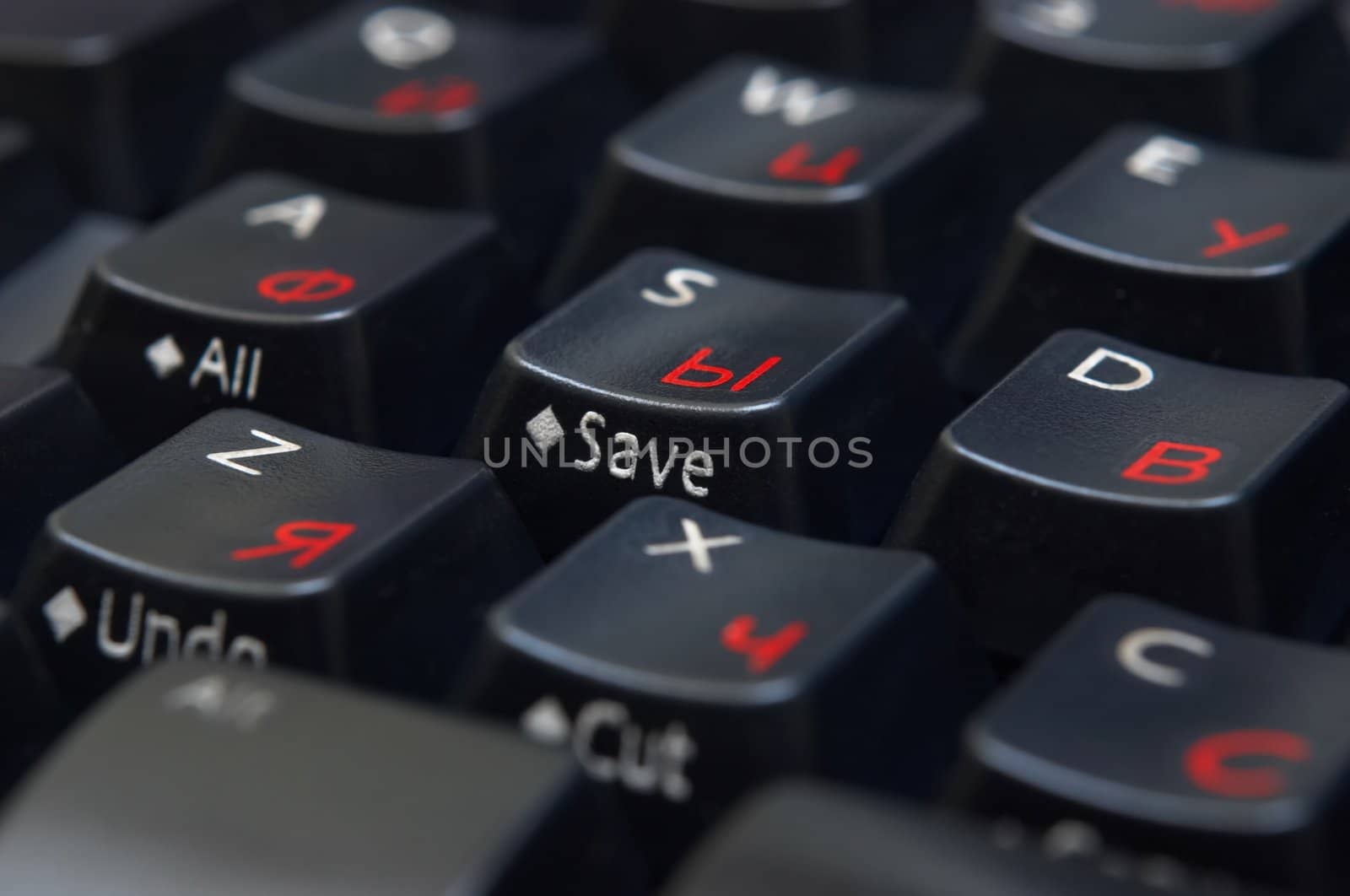 black keyboard with red cyrillic letters, closeup, macro.