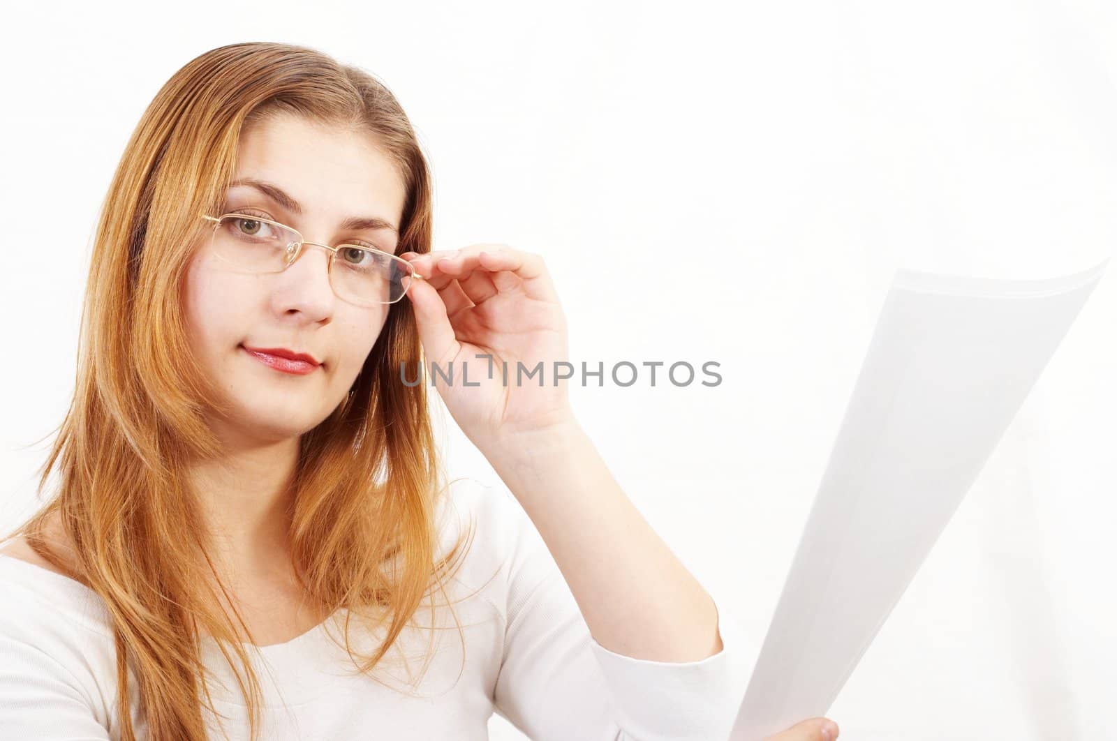 Young girl with sheets of paper in her hands