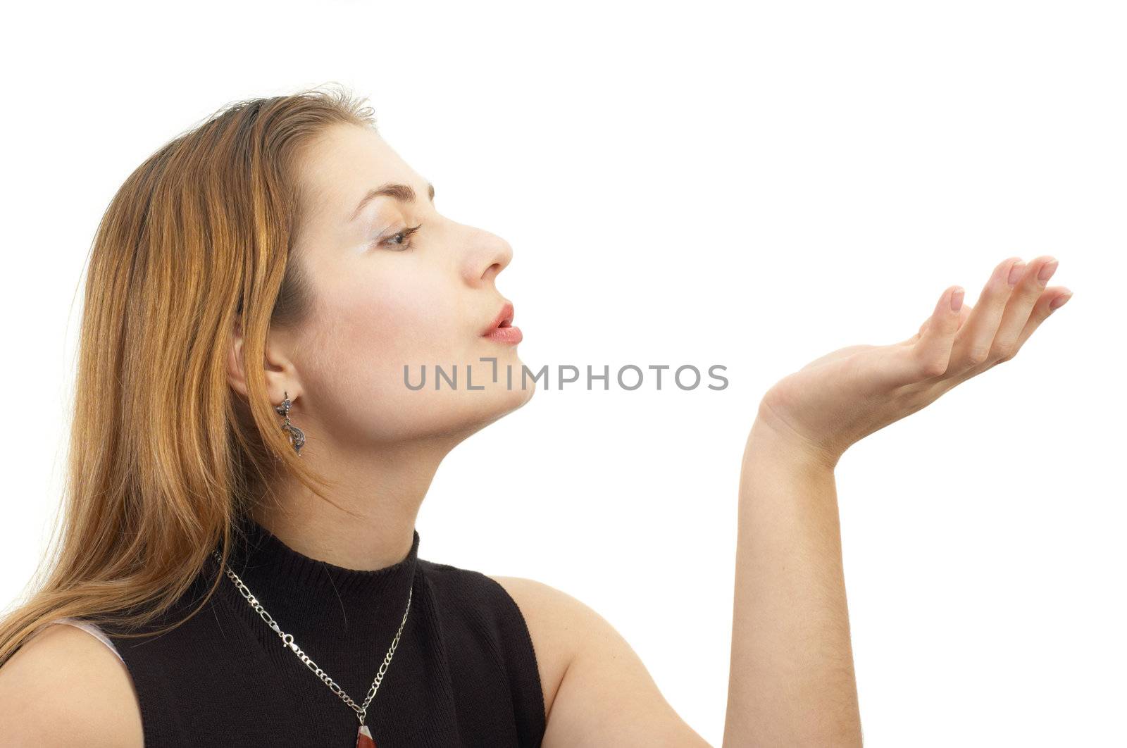 blond girl blowing something away from palm
