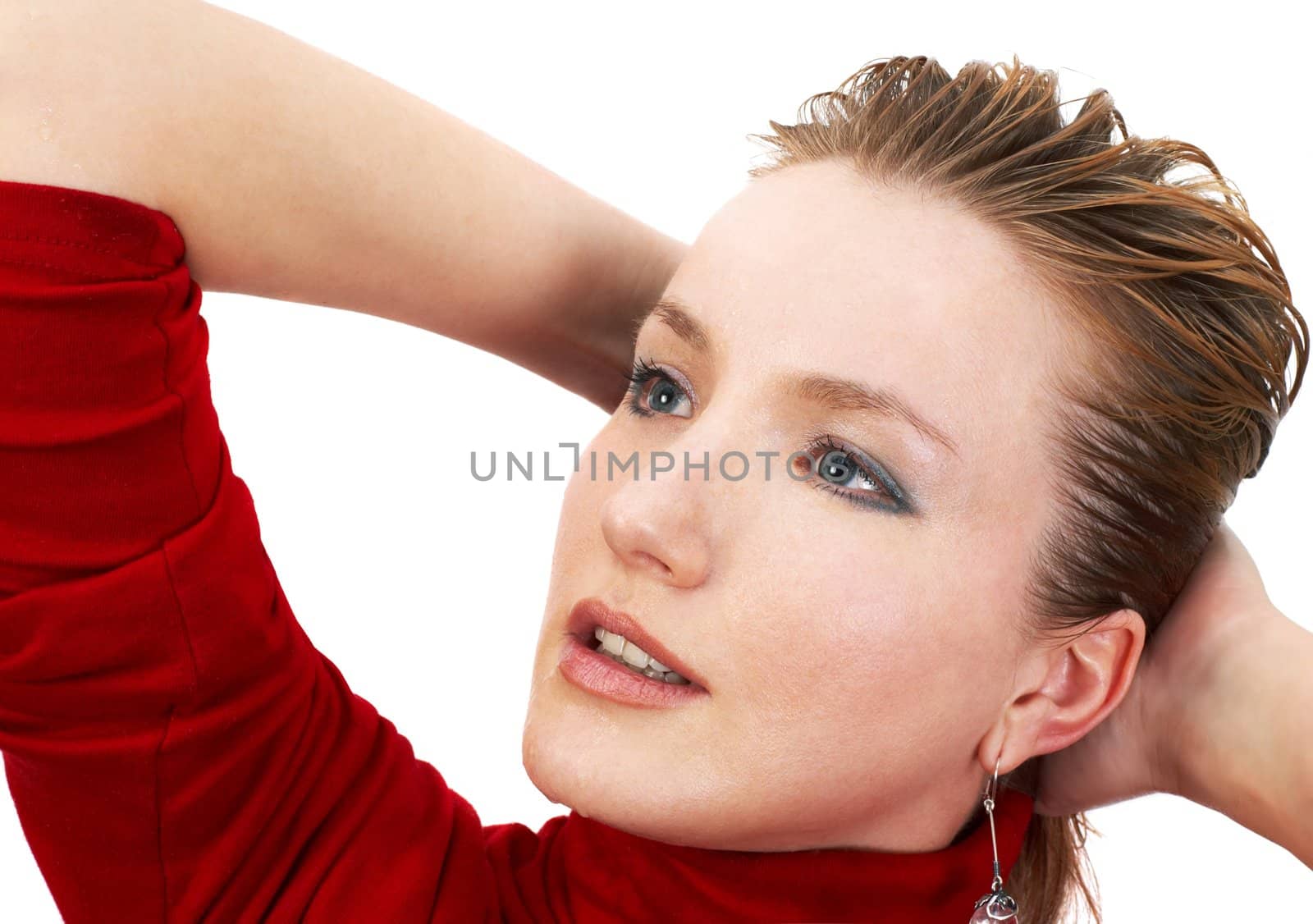 beautiful young blond girl with water on her face. isolated on white.