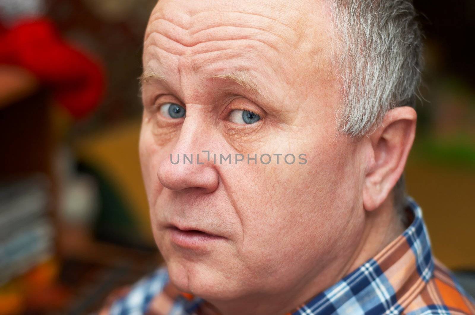 Casual bald senior man emotional portrait series.