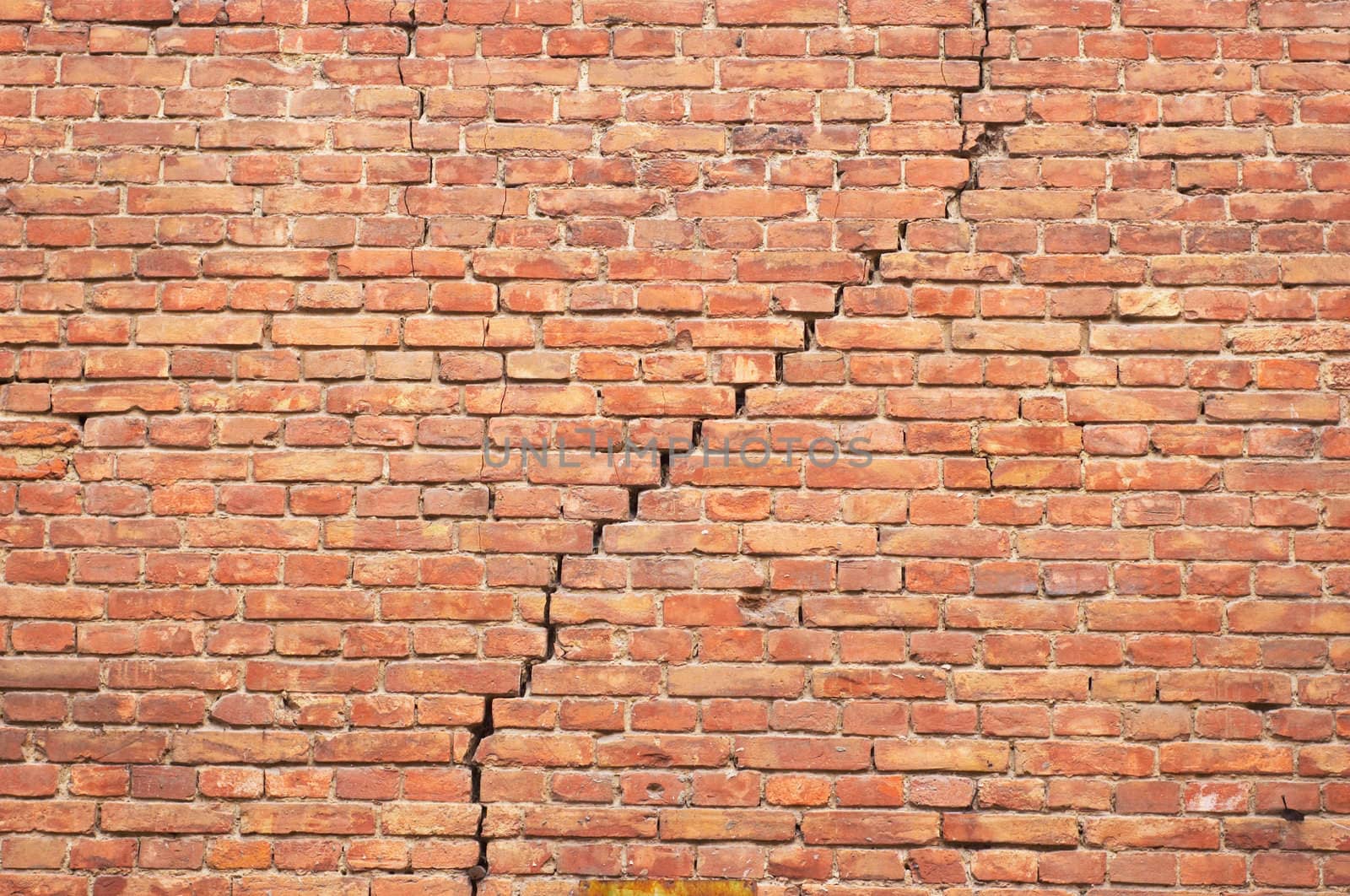 cracked red brick wall texture. grunge background.