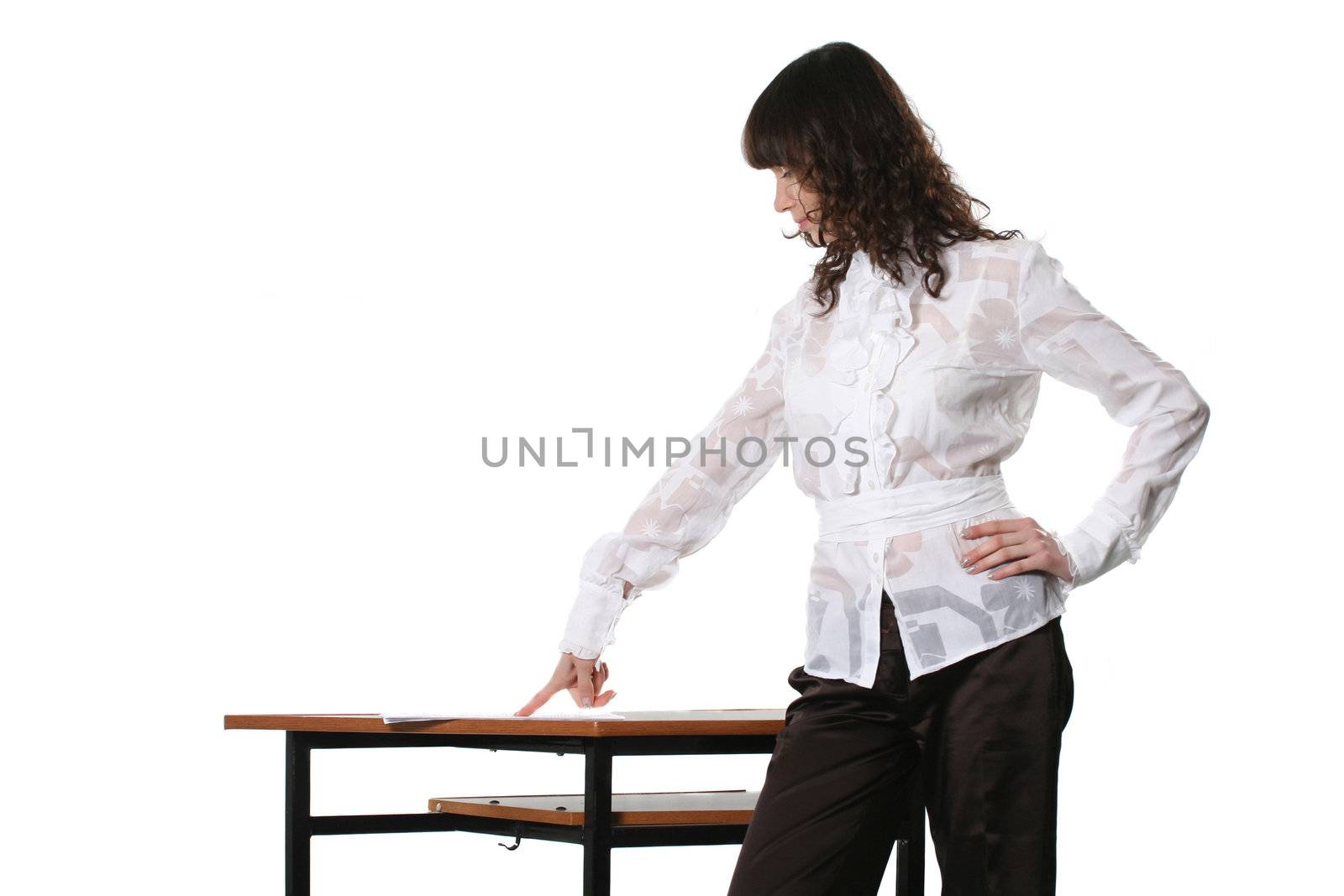 The business woman studies documents laying on a table