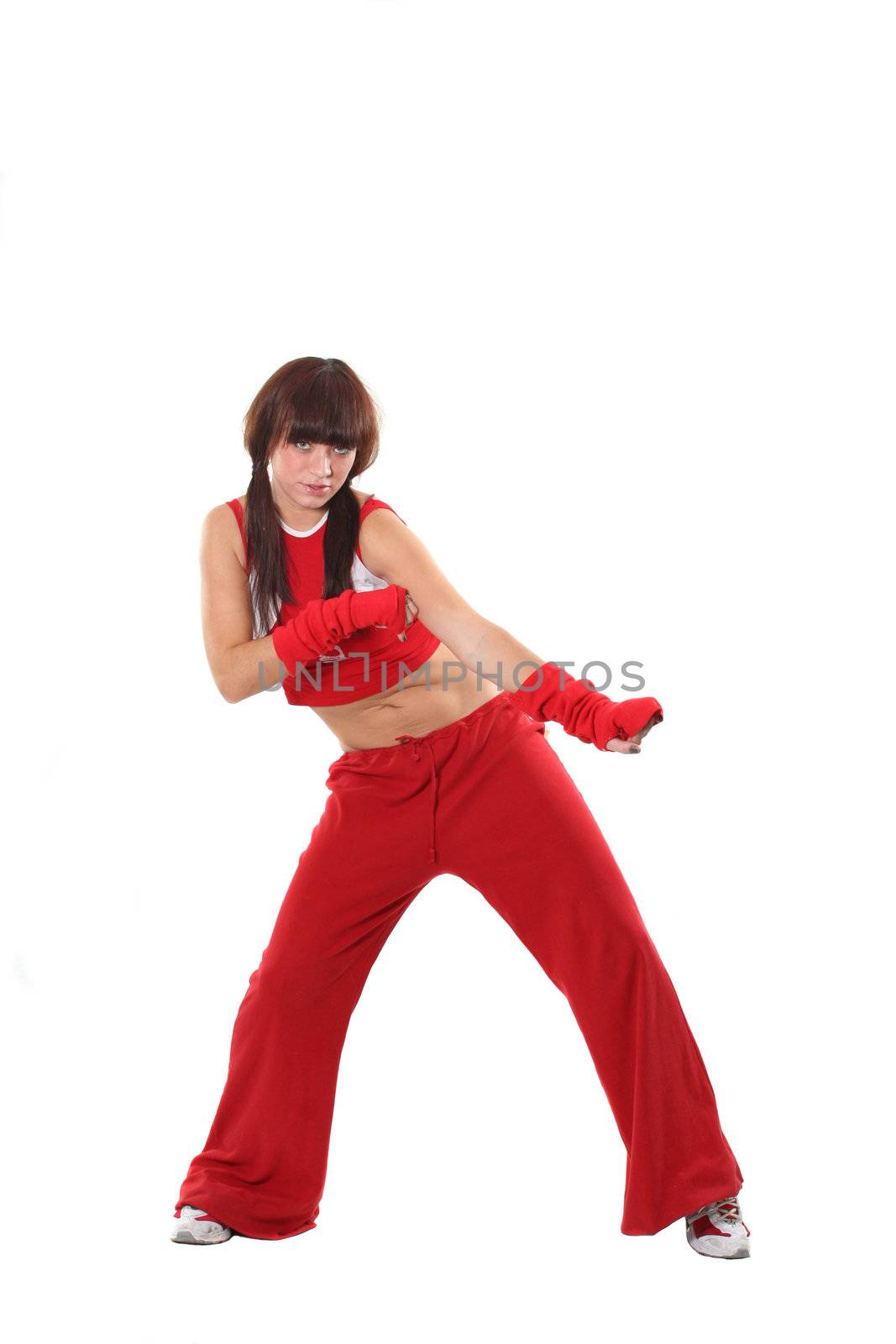 The beautiful girl dances in a red suit 