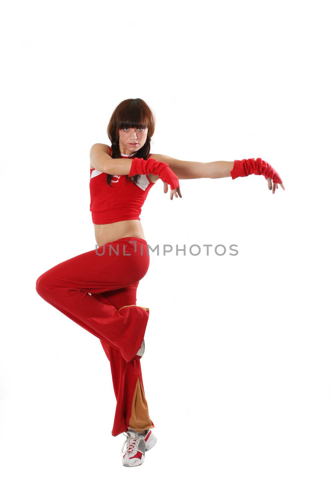 The beautiful girl dances in a red suit 