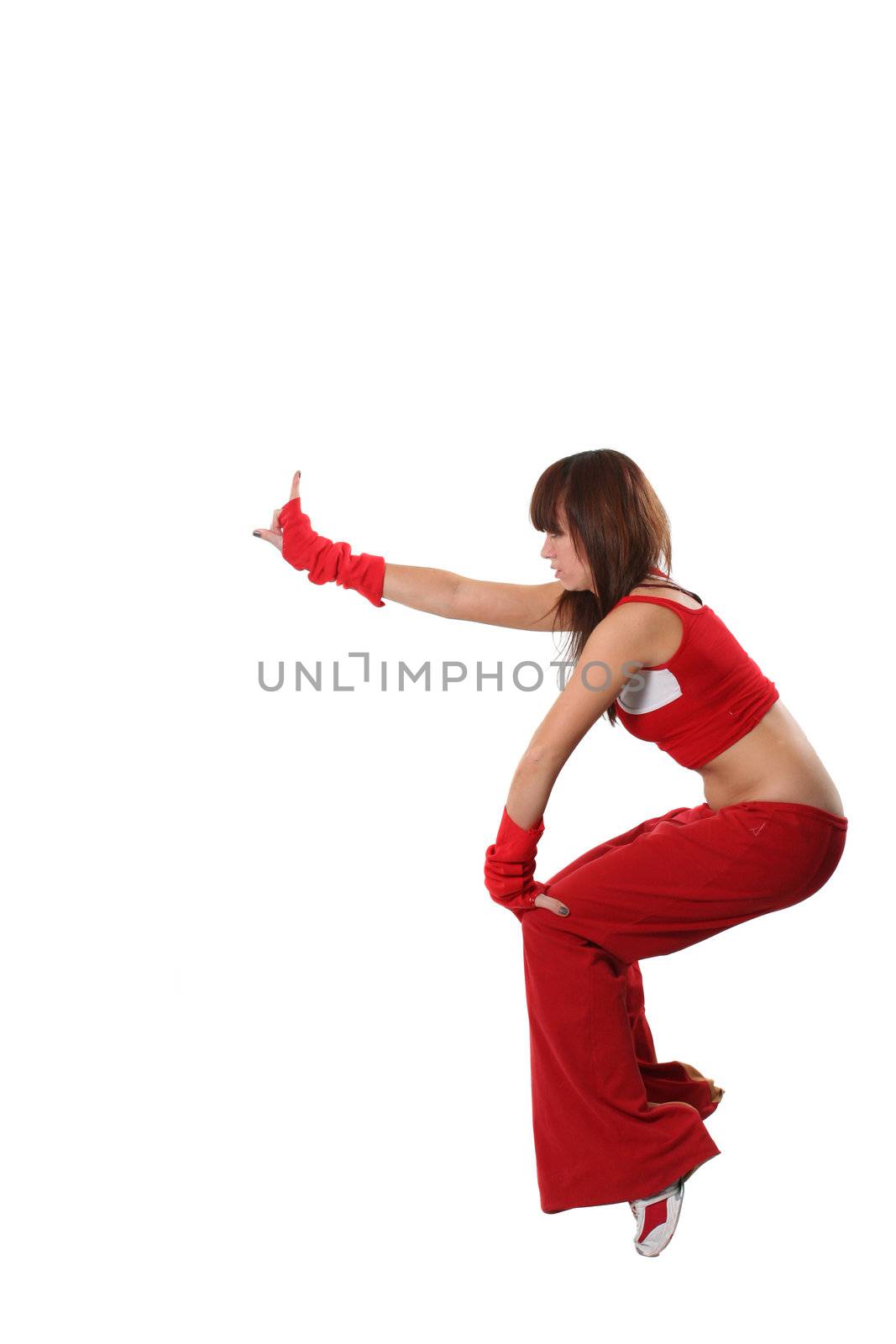 The beautiful girl dances in a red suit 