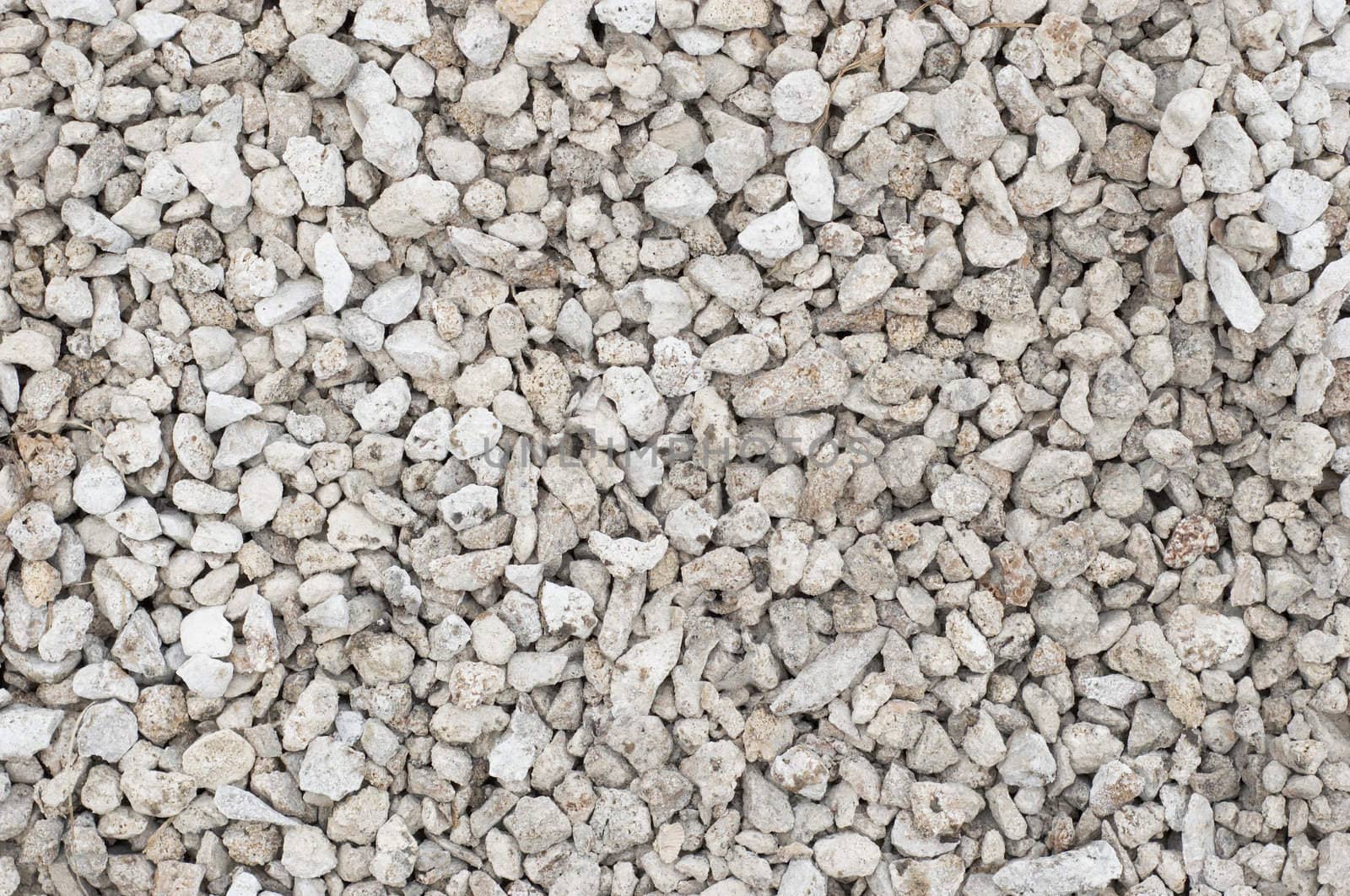 small crushed stones (road metal) material. textured background.