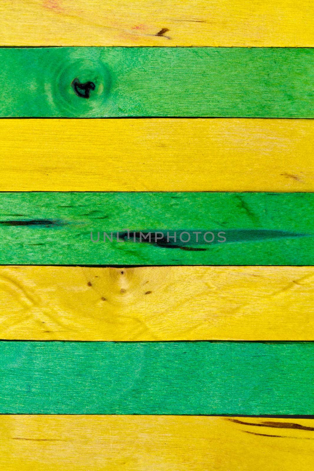 horizontal arrangement of green and yellow wood in portrait orientation