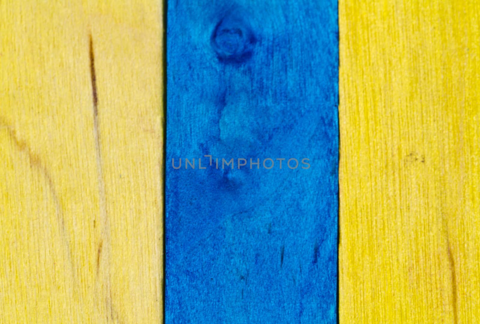 Vertical arrangement of blue and yellow wood in landscape orientation