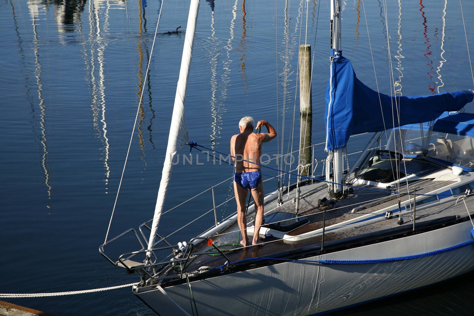 Early morning shower on deck of a saling boat.