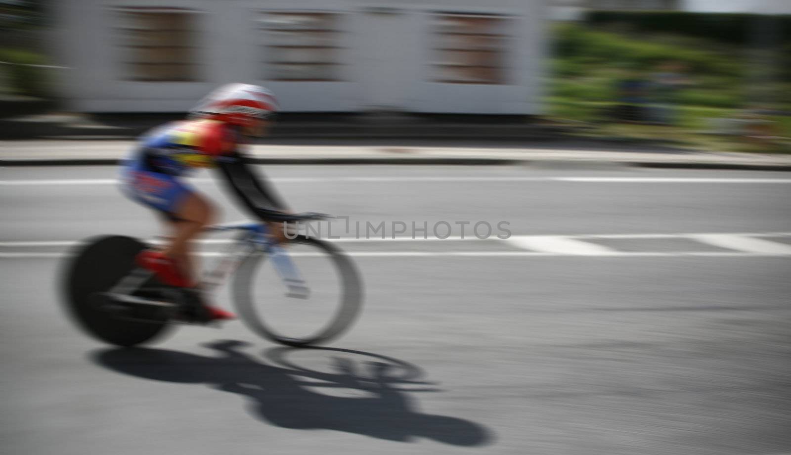 Young racing cyclist during the individual time trial to the Danish Championship 2011 in Nyborg Denmark. Intentional  motion blur.