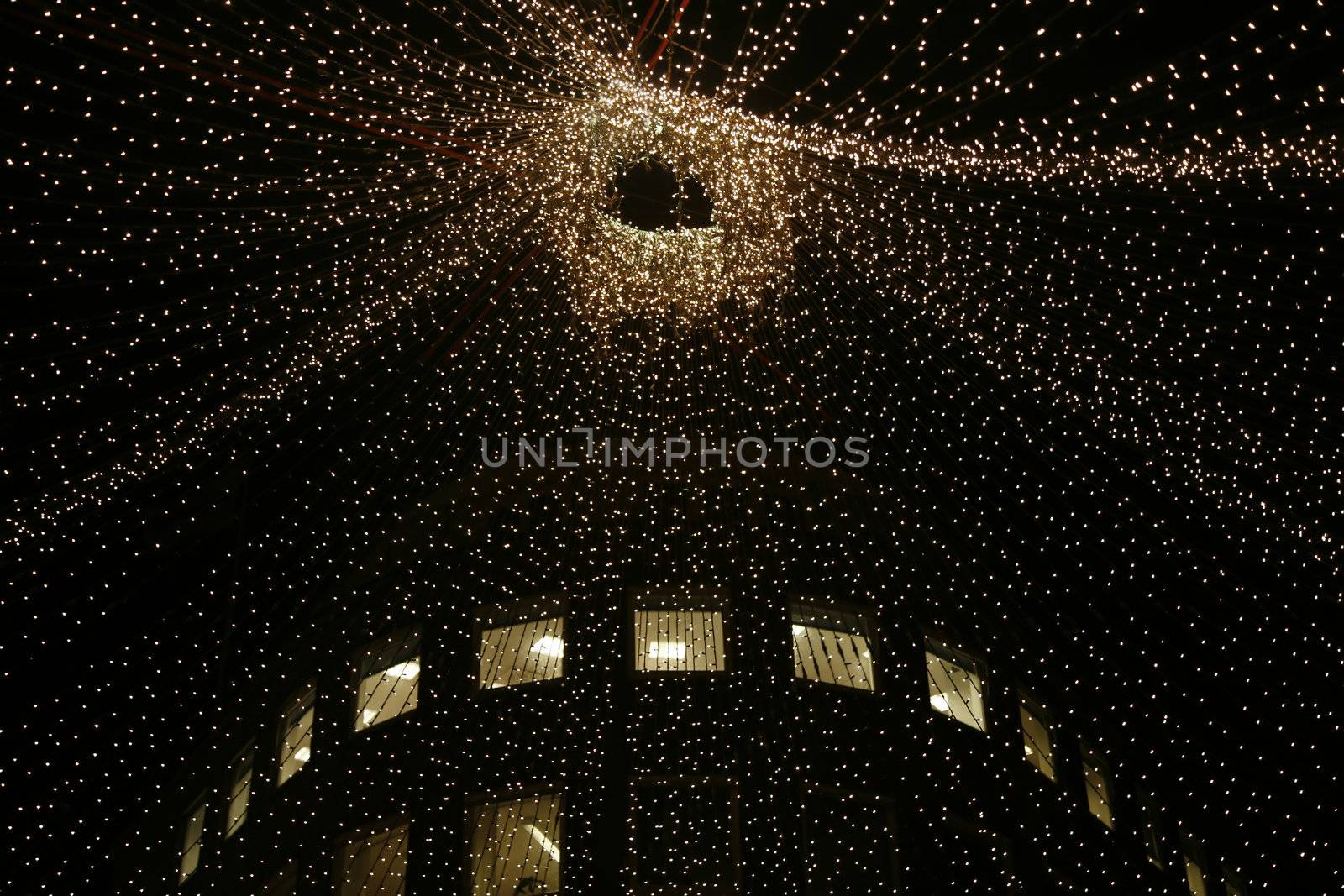 Urban christmas illumination - office building in background.