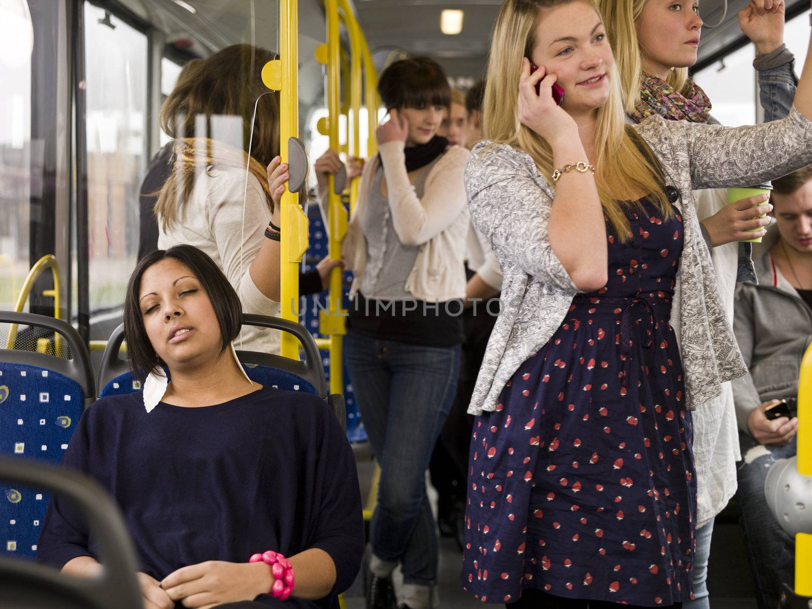 Woman sleeping while going by bus