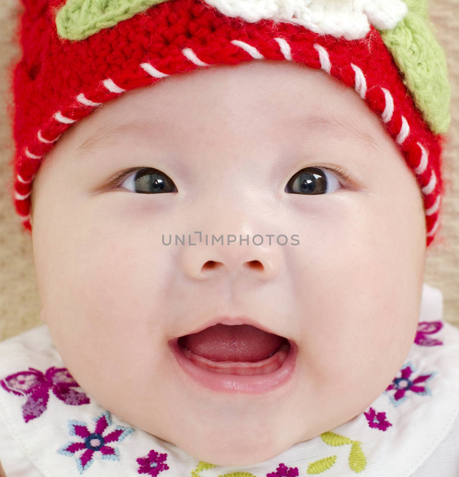 5 months old Asian baby girl smiling
