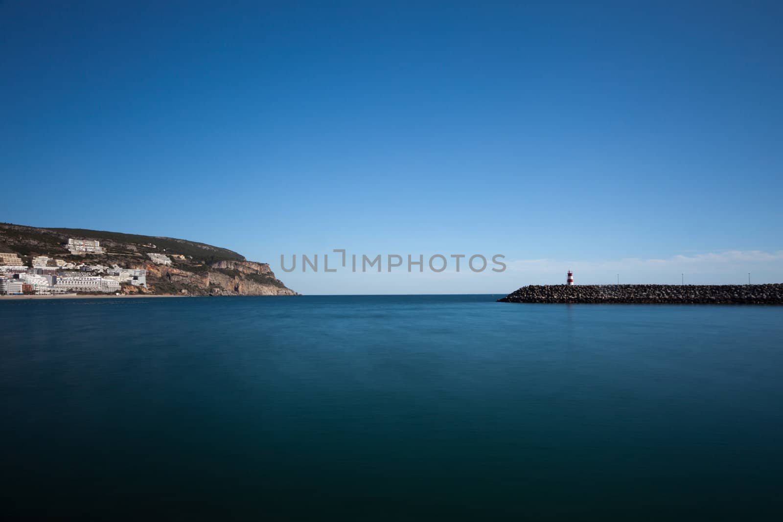 Lighthouse in port. Sesimbra, Portugal.