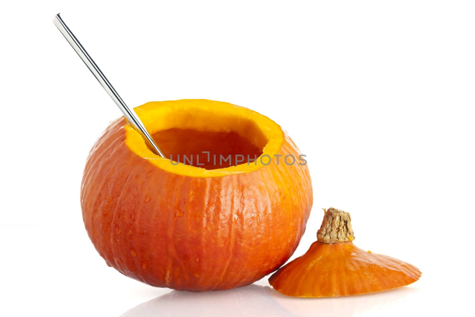 Pumpkin, with top remove and seeds cleand out, isolated on a white background.