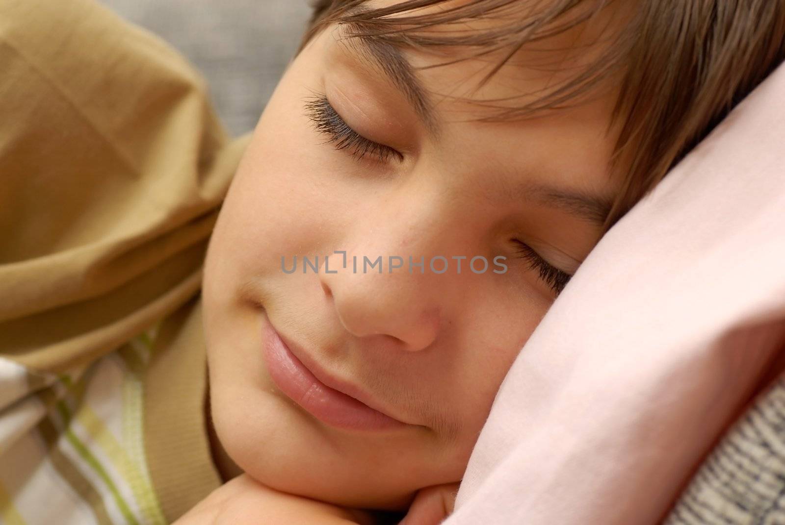 caucasian boy portrait, sleeping with arm under cheek