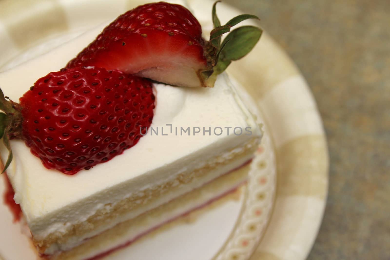 Layered strawberry shortcake with fresh strawberries on top