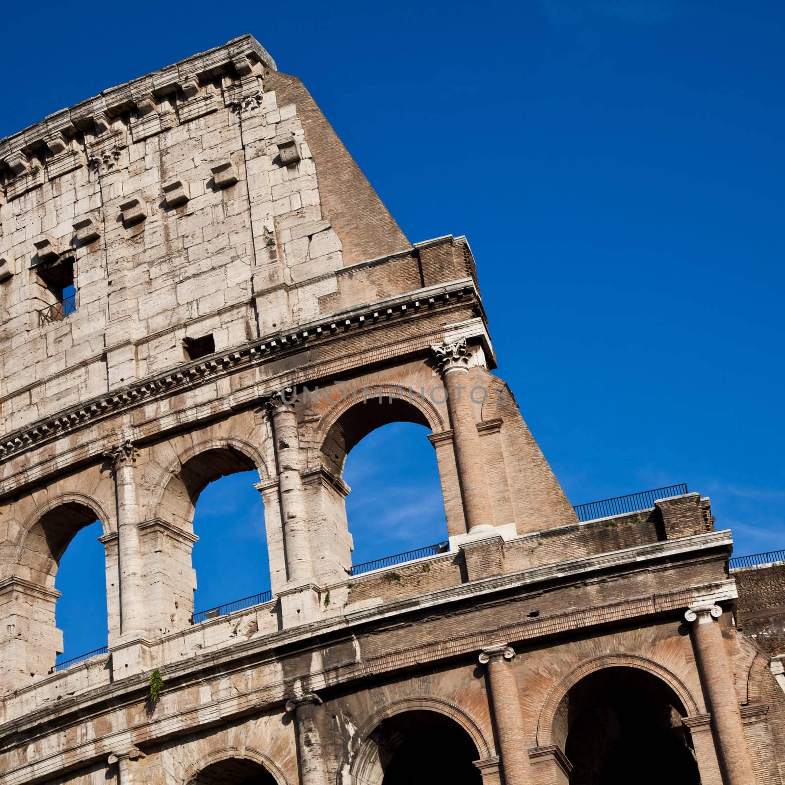 Colosseum in Rome with blue sky, landmark of the city