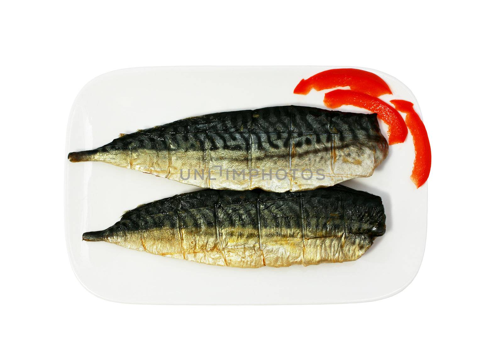 halfs of smoked mackerel on the plate isolated