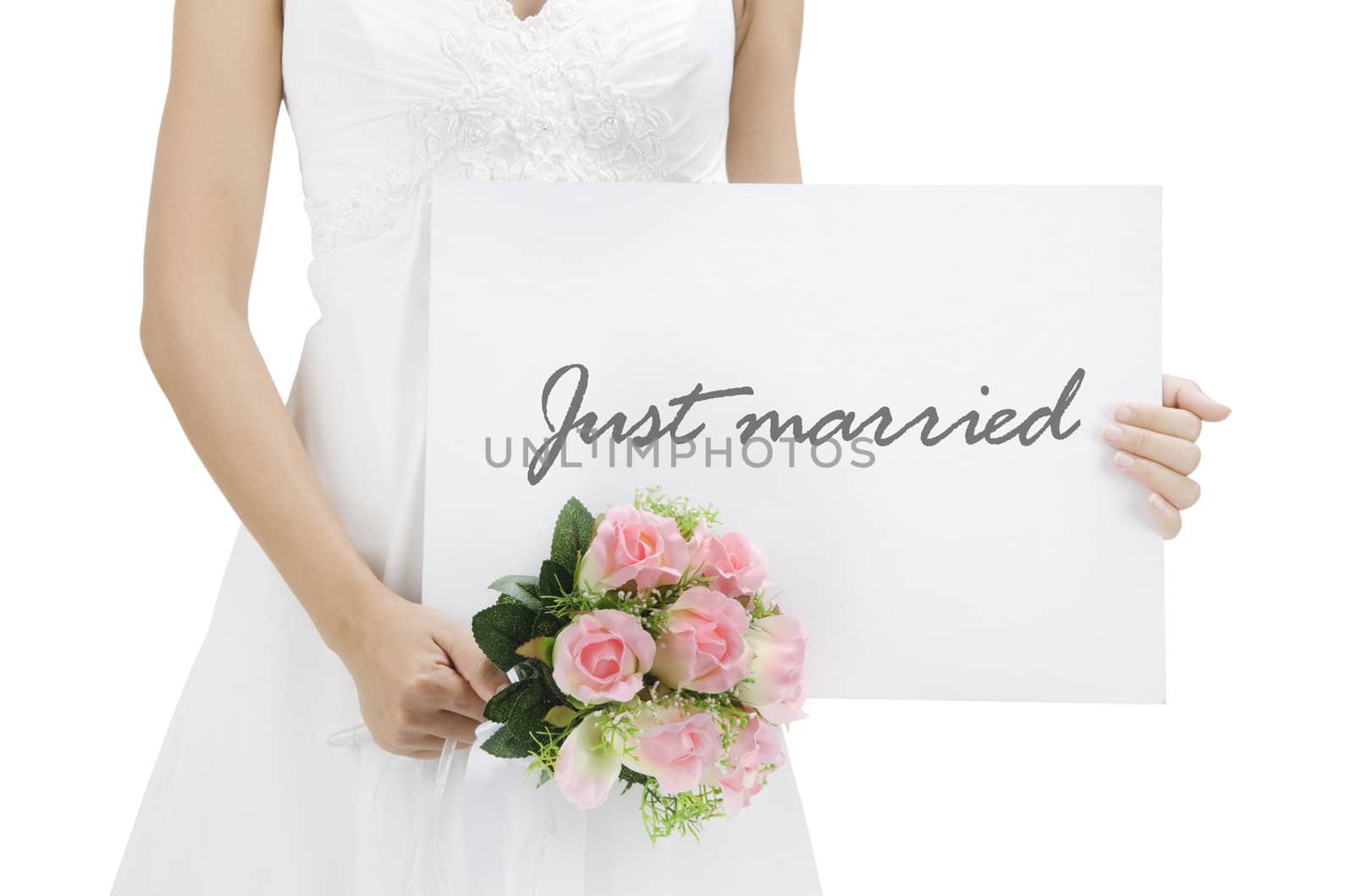 Bride holding a just married card