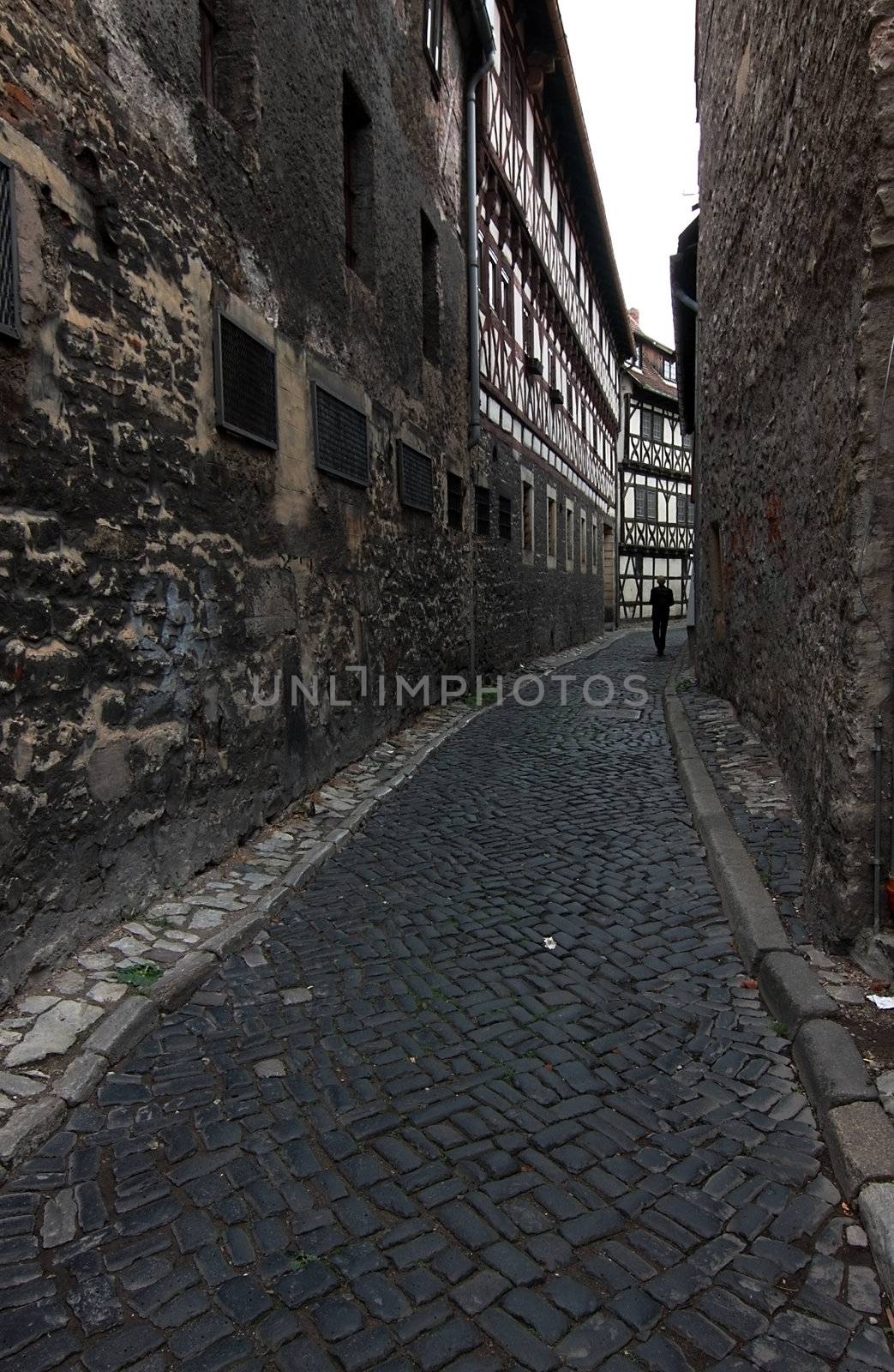 touneel street in between of two walls and single man