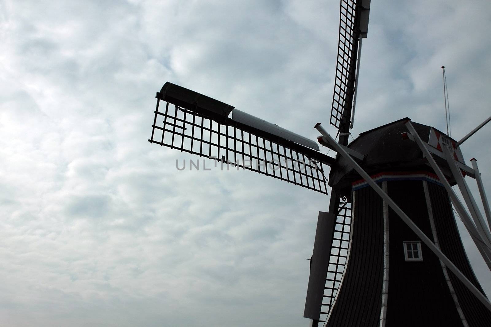 fragment of the windmill against the sun