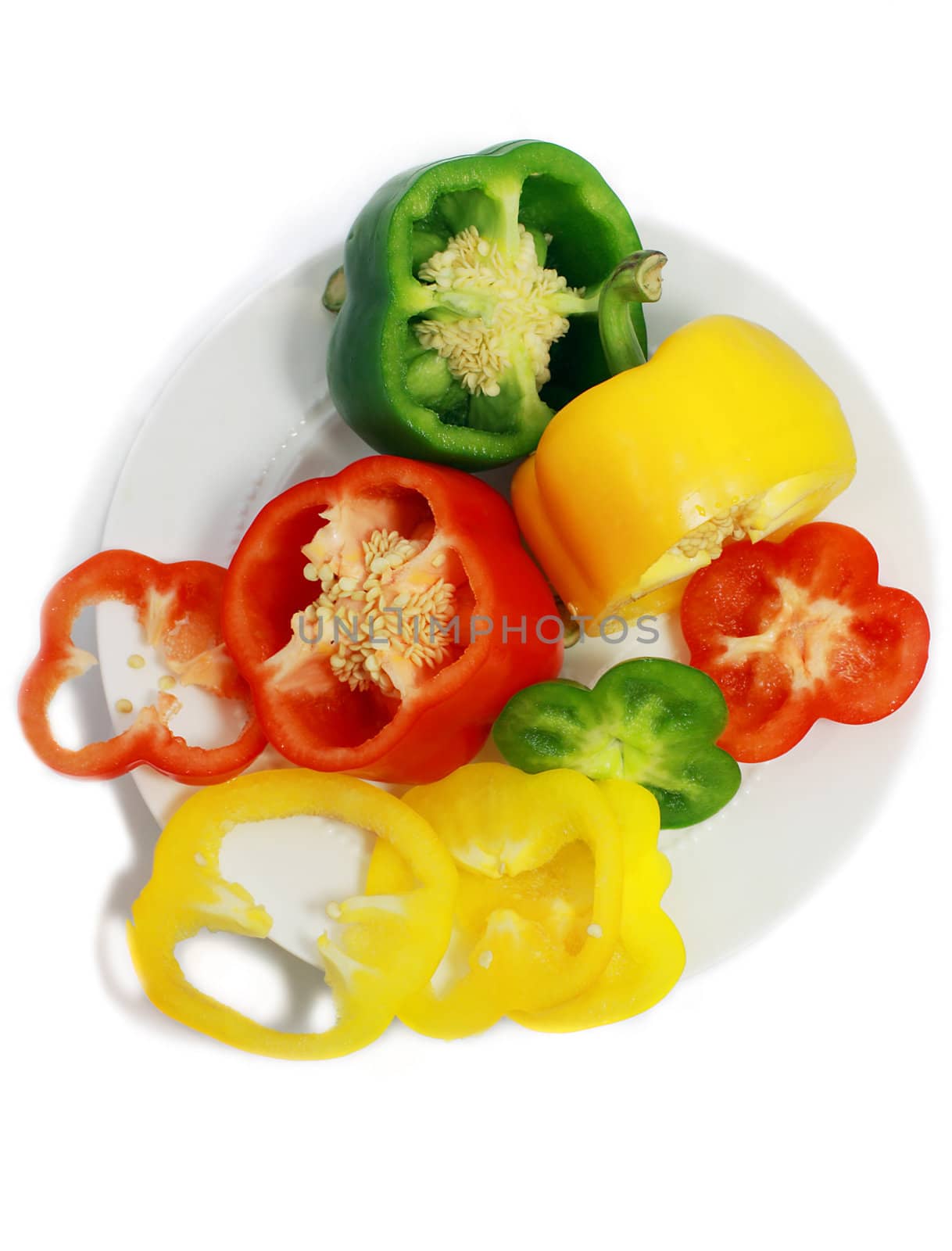 cut sweet peppers on the plate isolated
